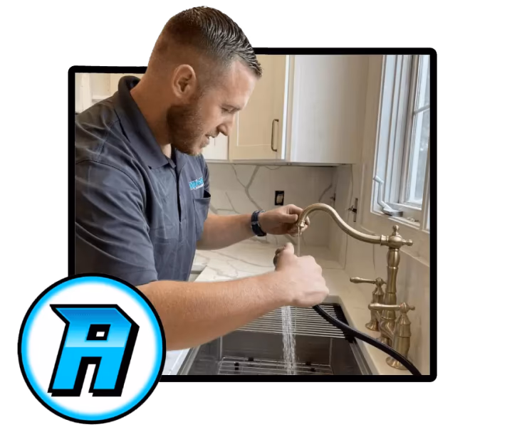 Clayton from Aqueduct Plumbing Services fixing a water line in a central Maryland kitchen.