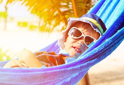 Little boy relaxing on summer vacation