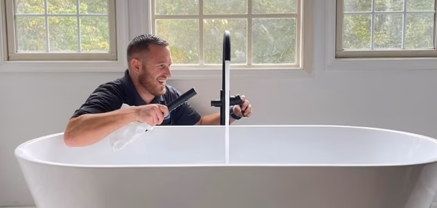 Professional plumber installing a soaking tub in a Maryland home